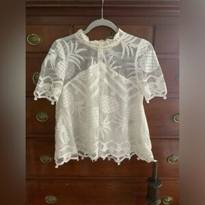 Sheer top with designs